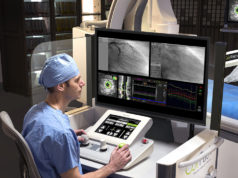 US FDA clears CorPath GRX system for use in peripheral vascular interventions Surgeon driving CorPath GRX system
